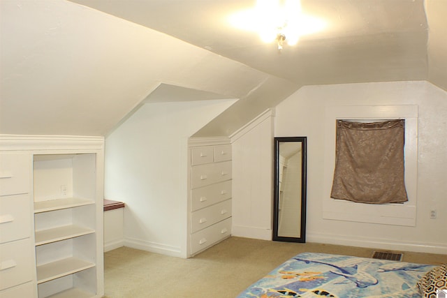 interior space with lofted ceiling and light colored carpet