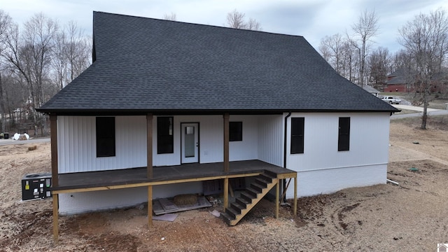 rear view of property featuring a porch