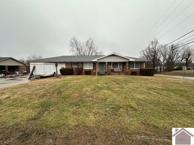 ranch-style house with a garage and a front yard