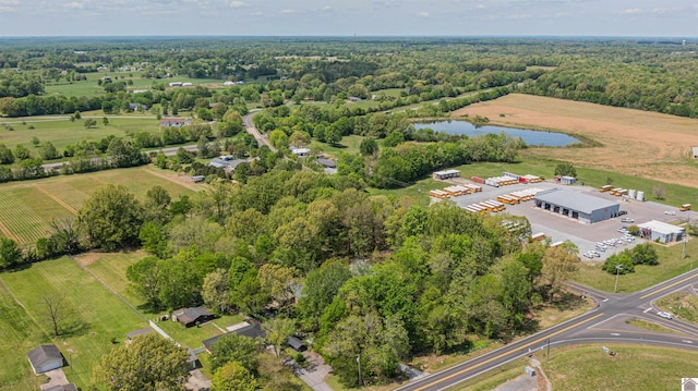 birds eye view of property featuring a rural view and a water view