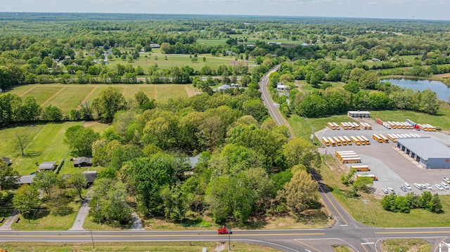 bird's eye view featuring a water view and a view of trees