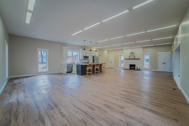 unfurnished living room with hardwood / wood-style floors