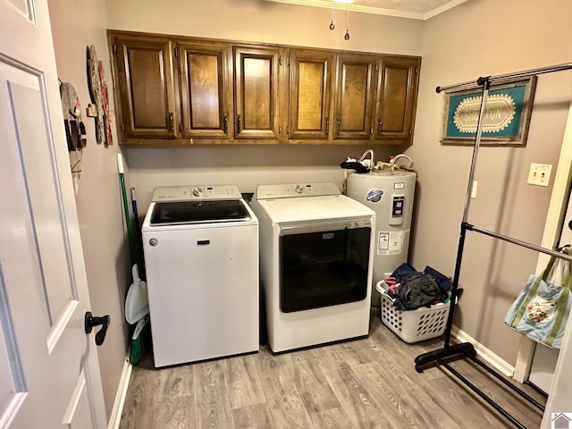 clothes washing area with cabinets, washer and dryer, electric water heater, and light wood-type flooring