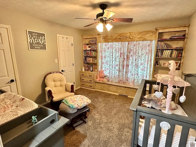 bedroom featuring ceiling fan, carpet flooring, and a textured ceiling