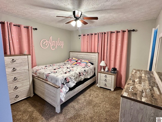 carpeted bedroom featuring ceiling fan and a textured ceiling