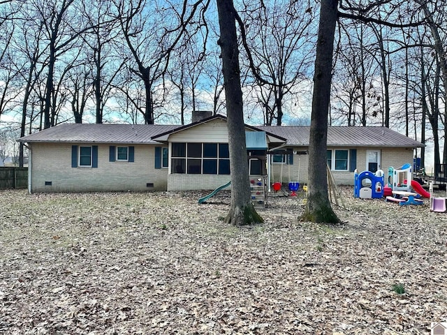 view of front of property with a playground