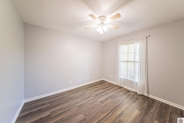 unfurnished room with ceiling fan, dark hardwood / wood-style floors, and a textured ceiling