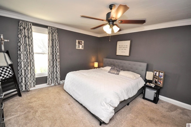 bedroom featuring crown molding, ceiling fan, and light carpet