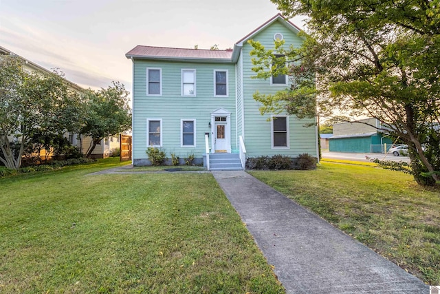 view of front of house with a lawn