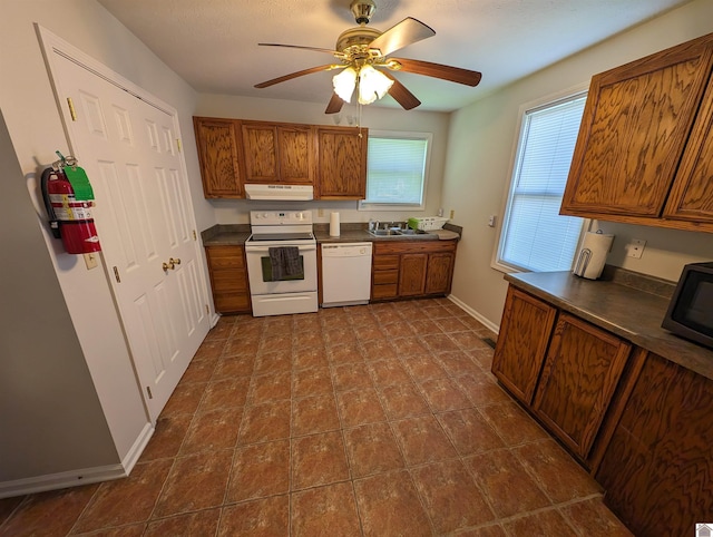 kitchen with ceiling fan, sink, and white appliances