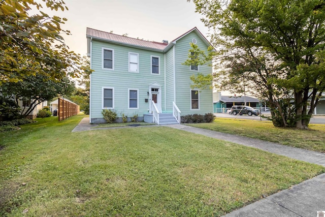 view of front of home with a front yard