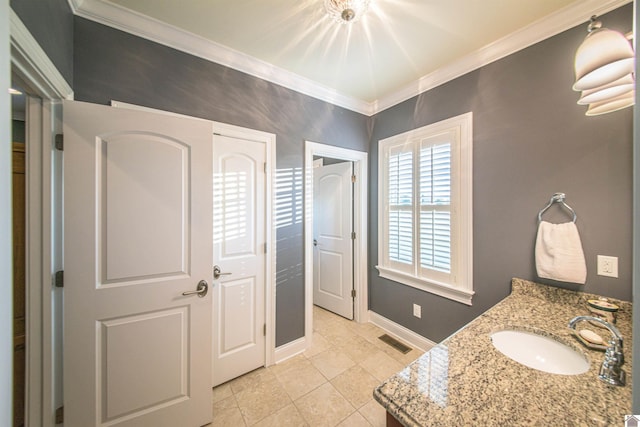 bathroom with vanity, tile patterned flooring, and ornamental molding