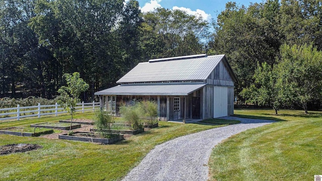 view of outdoor structure featuring a yard