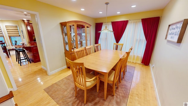 dining space with light wood-type flooring