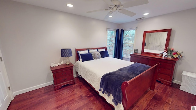 bedroom with radiator heating unit, dark hardwood / wood-style floors, and ceiling fan