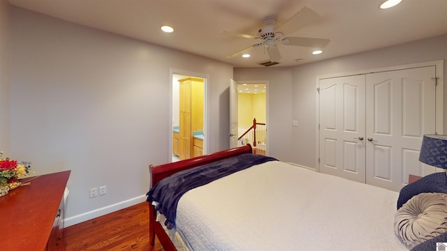 bedroom featuring ceiling fan, dark wood-type flooring, and a closet