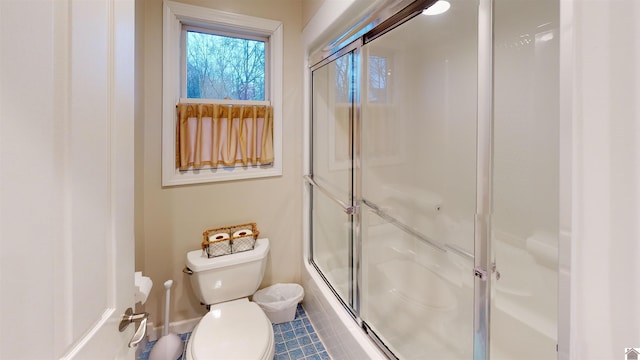 bathroom with toilet and walk in shower