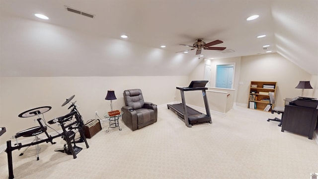 workout area with ceiling fan, light colored carpet, and lofted ceiling