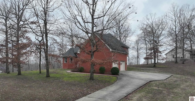 view of side of home featuring a garage