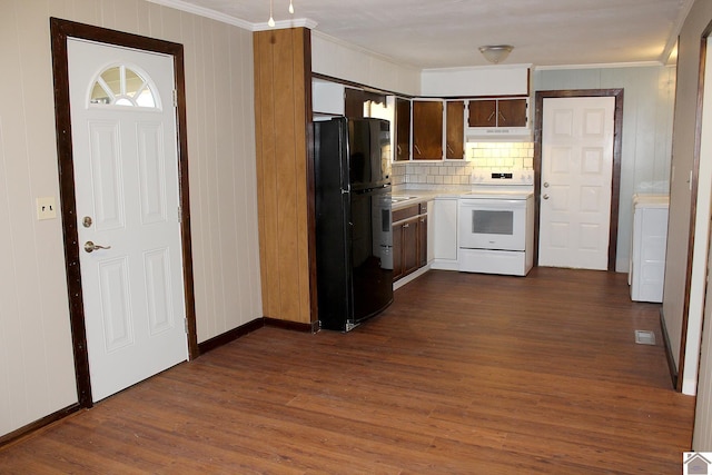 kitchen with electric range, black refrigerator, ornamental molding, dark hardwood / wood-style flooring, and decorative backsplash