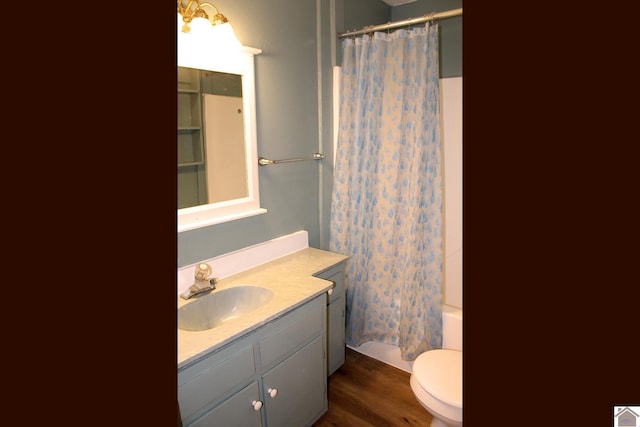 full bathroom featuring vanity, toilet, and shower / bath combo with shower curtain