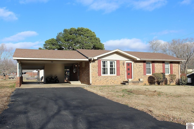 ranch-style house featuring a carport