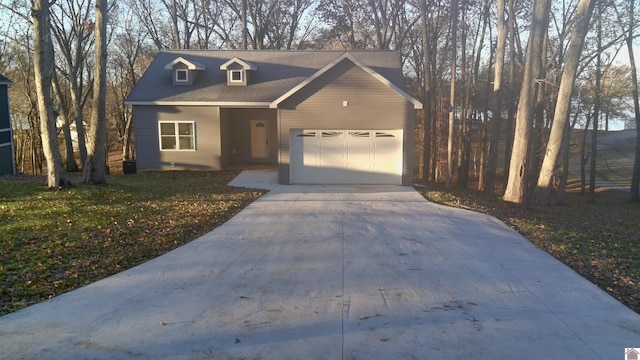 view of front of house featuring a garage and a front yard