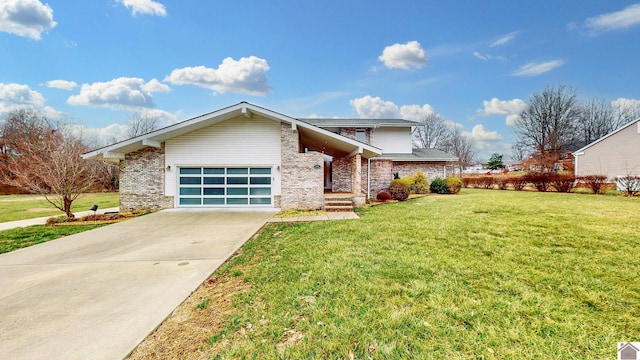 view of front of house with a garage and a front yard