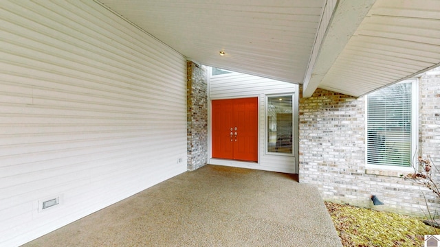 entrance to property with a patio