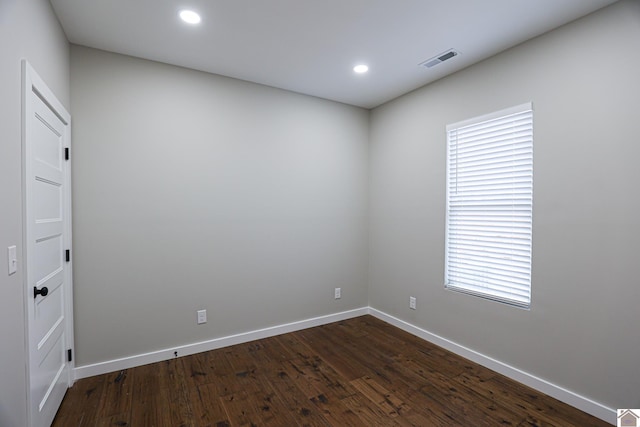 unfurnished room with dark hardwood / wood-style floors