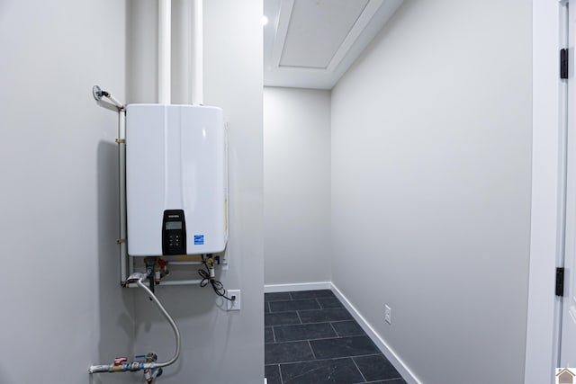 utility room with tankless water heater