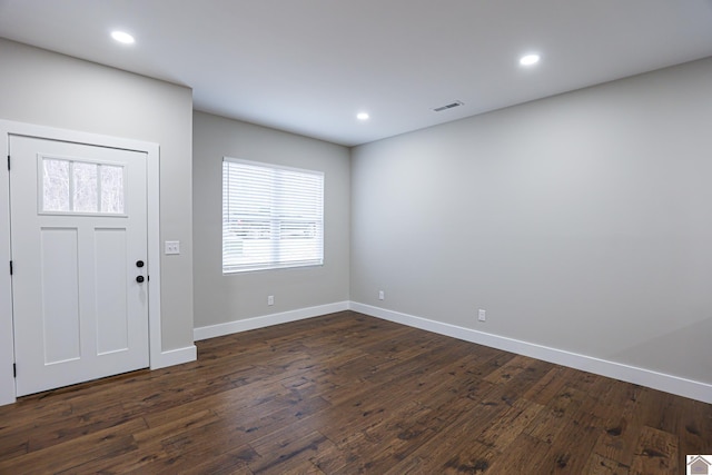 foyer with dark hardwood / wood-style floors