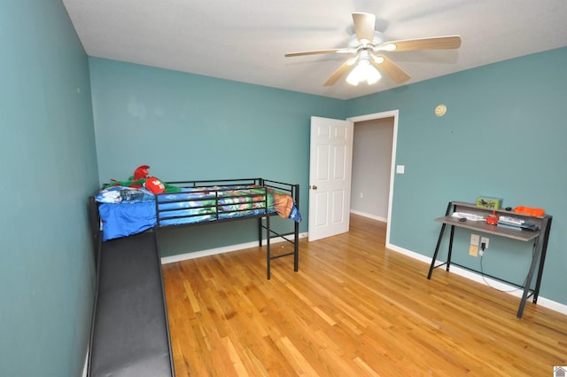 bedroom featuring hardwood / wood-style flooring and ceiling fan