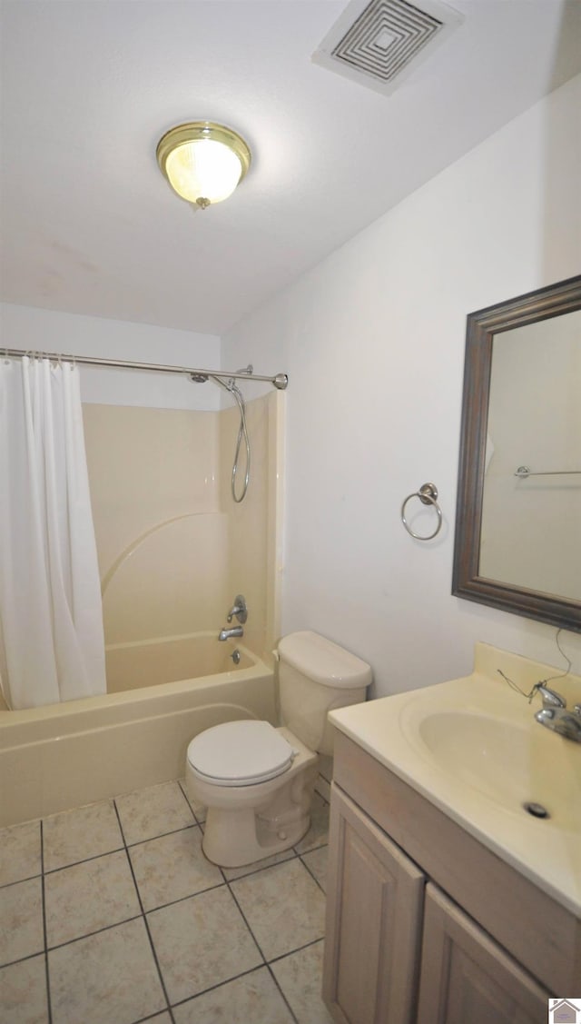 full bathroom featuring tile patterned floors, toilet, shower / bath combo, and vanity