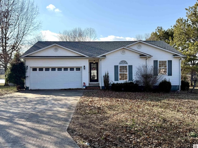 single story home featuring a garage