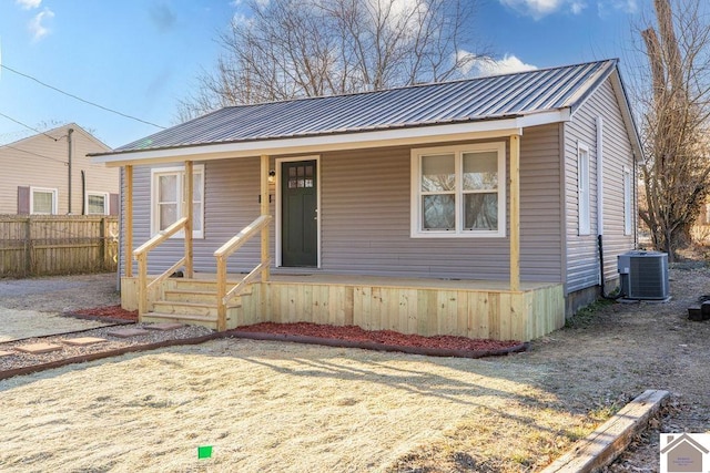 view of front of home with central air condition unit and covered porch