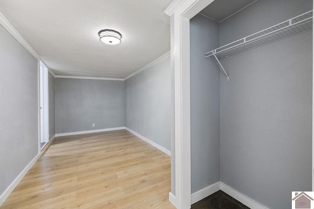 walk in closet with light wood-type flooring