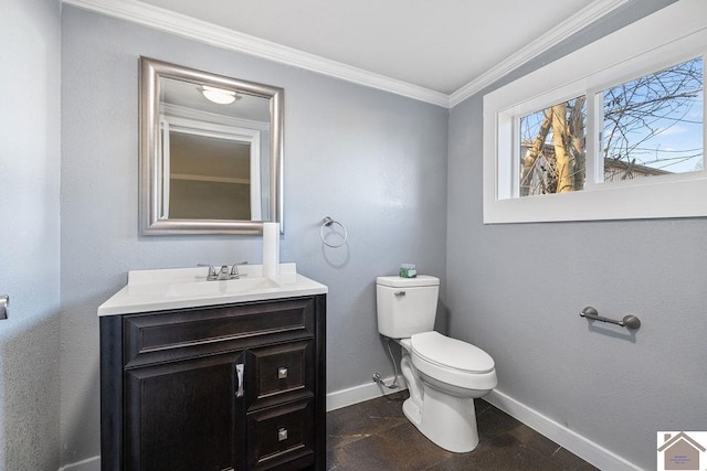 bathroom featuring toilet, vanity, and crown molding