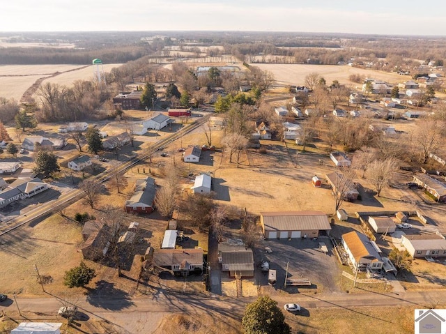 birds eye view of property with a rural view