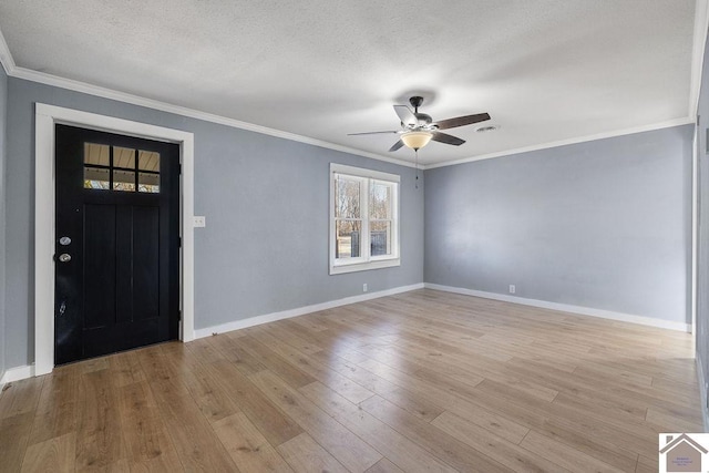 entryway with light hardwood / wood-style floors, crown molding, a textured ceiling, and ceiling fan