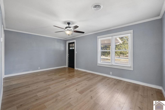 empty room with ceiling fan, crown molding, and light hardwood / wood-style floors