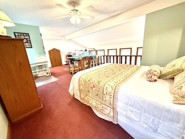 bedroom featuring a ceiling fan, carpet, lofted ceiling with beams, and a textured ceiling