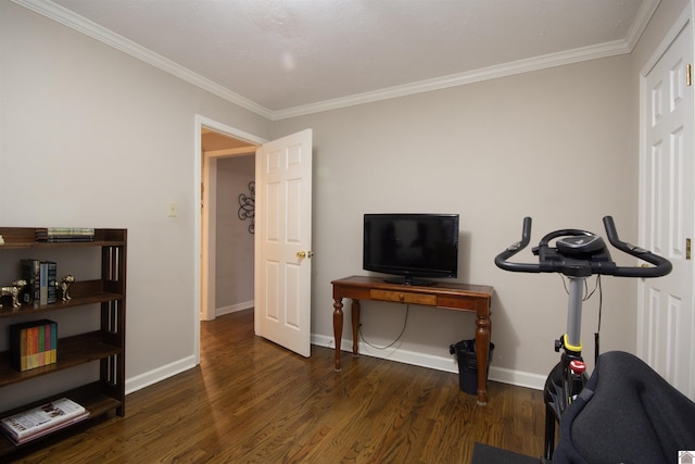 exercise area with ornamental molding and dark hardwood / wood-style floors