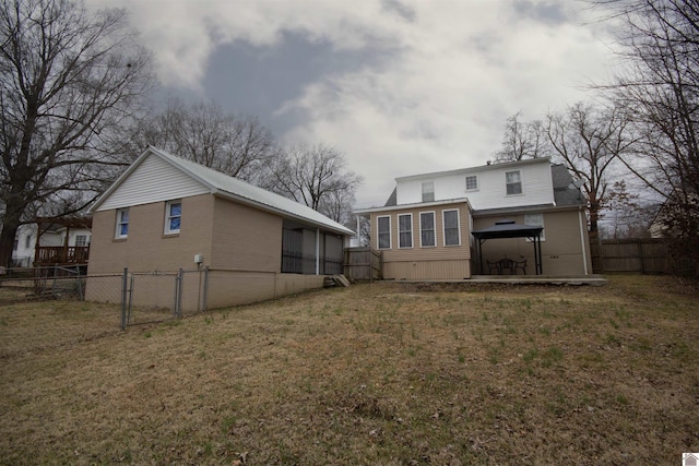 back of property with a gazebo and a lawn