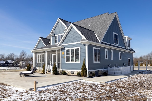 view of front of home featuring a patio and a sunroom