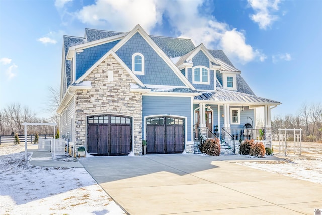 craftsman-style home with a garage and a porch