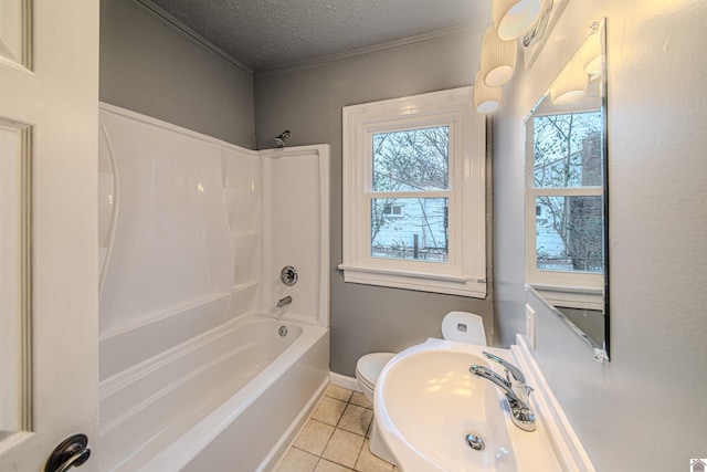 bathroom featuring shower / bathtub combination, toilet, a sink, a textured ceiling, and tile patterned floors