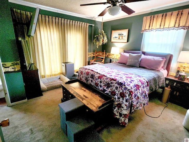 bedroom featuring carpet floors, a ceiling fan, and crown molding