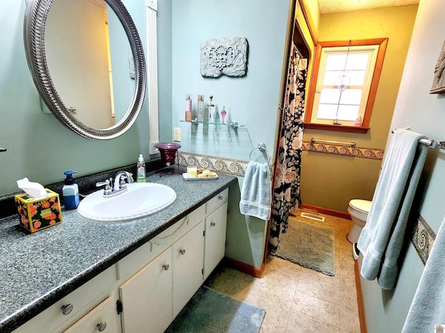 full bathroom featuring baseboards, visible vents, vanity, and toilet