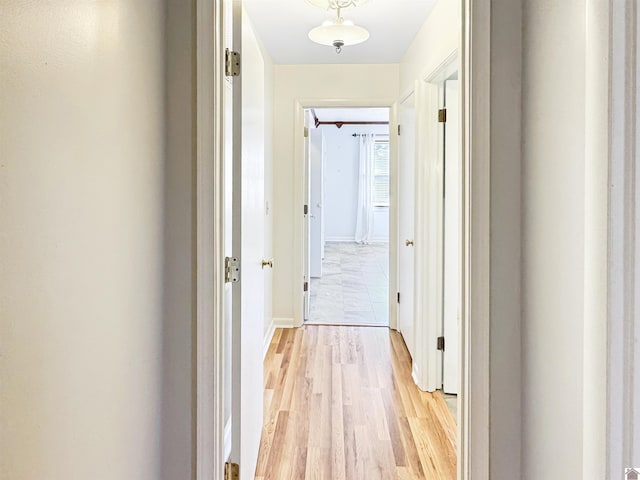 corridor with light wood finished floors